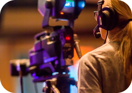 A lady filming a production