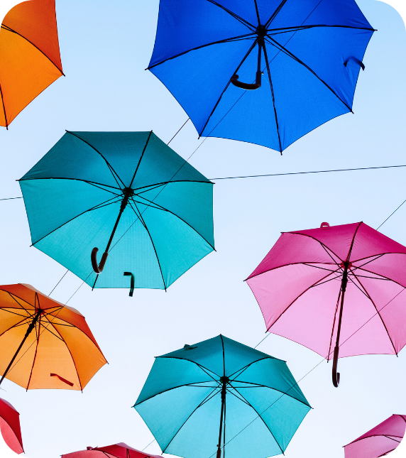 Coloured umbrellas against blue sky