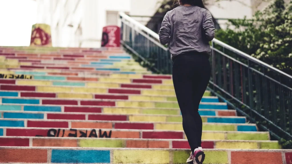 Woman running up the stairs